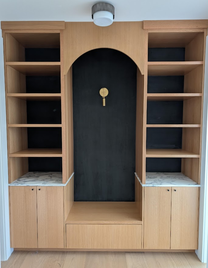 Wallpaper installation behind custom built-in shelving