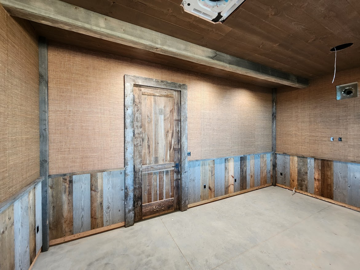 Grasscloth wallpaper with reclaimed wood wainscoting